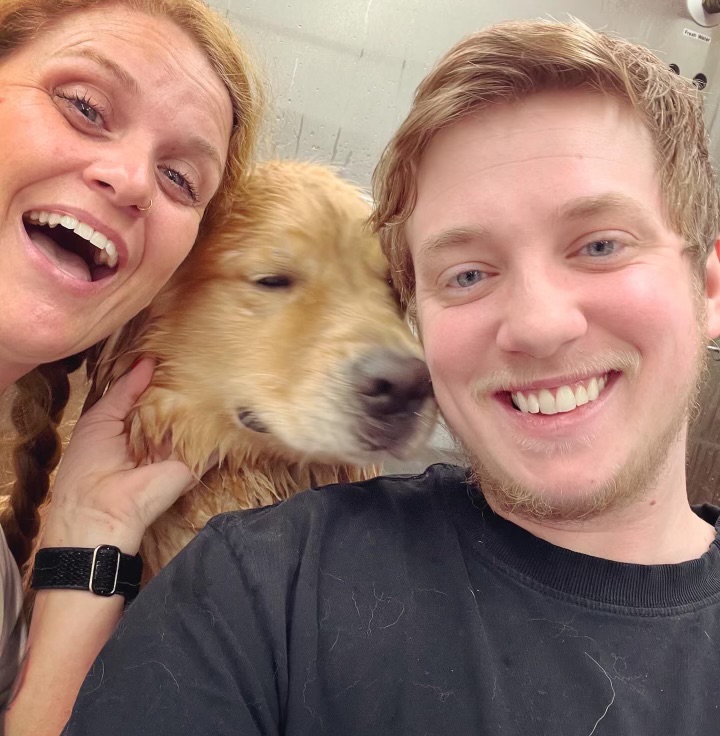 Ashleigh with a freshly groomed dog inside the mobile grooming van